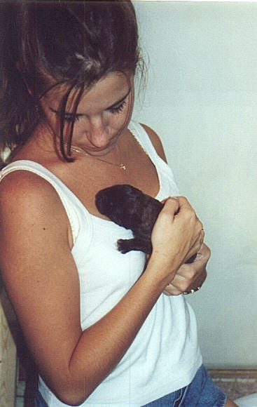 Kelly holding puppy that is just 15 minutes old.  